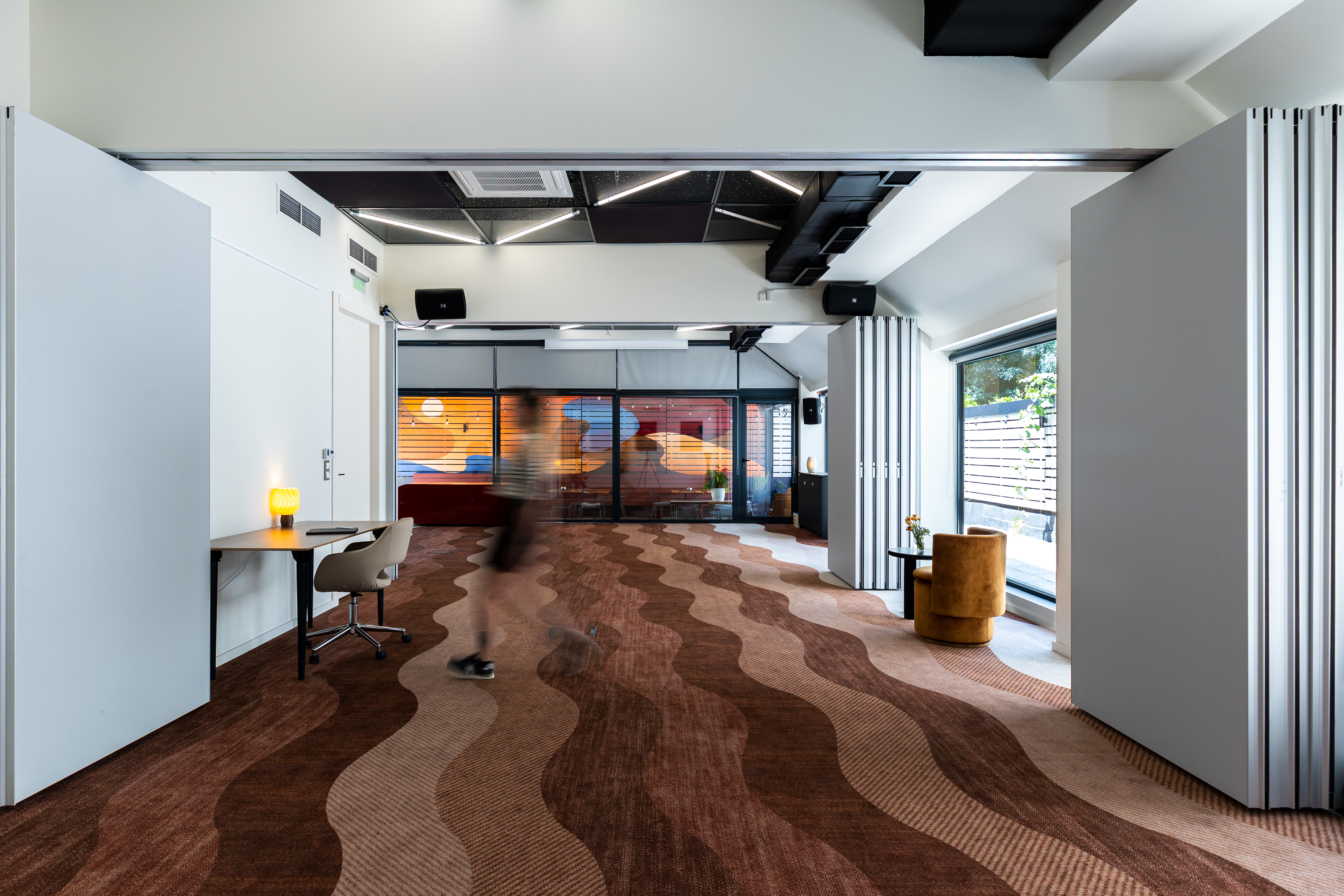 Open event hall with wave-patterned carpet